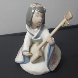 Nao by Lladro" piece called "Oriental Song" or "Young Geisha Girl Playing Lute
